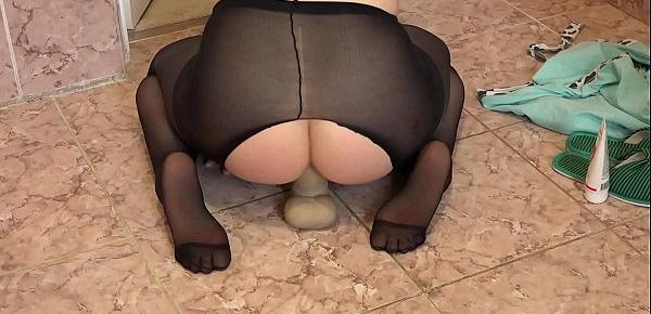  Brunette in pantyhose fucks anal in the bathroom. Big dildo stretches the juicy butt to orgasm.